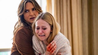 Benson hugging a victim who is crying and has a bloody hand on Law & Order: SVU Season 26 Episode 2