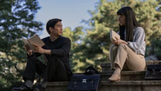 Noa & his girlfriend sit on steps at college