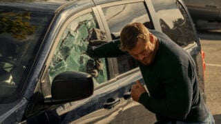 Reacher smashes into a window.